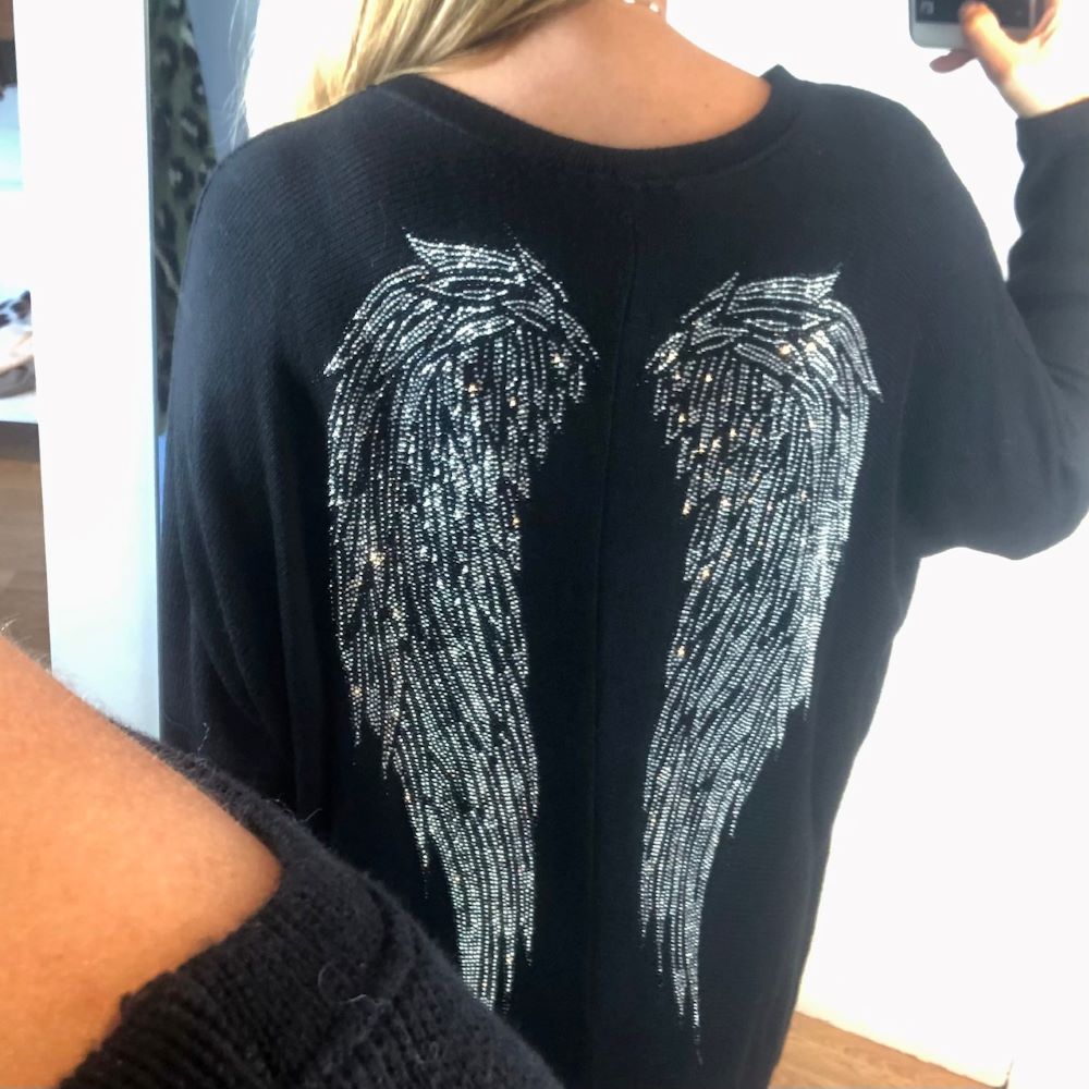 ropa-low-cost-mujer-jersey-alas-espalda-zoom